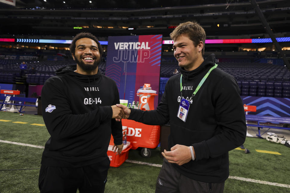 INDIANAPOLIS, INDIANA - MARCH 2: Caleb Williams #QB14 of Southern California greets Drake Maye #QB04 of North Carolina during the NFL scouting combine at Lucas Oil Stadium on March 2, 2024 in Indianapolis, Indiana. (Photo by Kara Durrette/Getty Images)