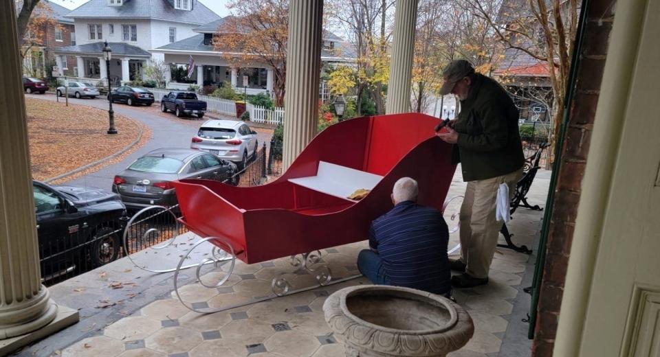 Volunteers work on Cockade City Garden Club's sleigh display for the 2023 Centre Hill Holiday Showcase in Petersburg.