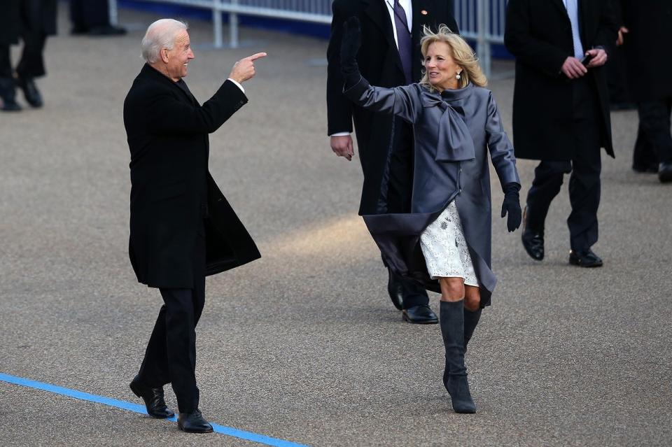 Joe and Jill Biden pump each other up during the presidential inaugural parade through the capital on January 21, 2013.