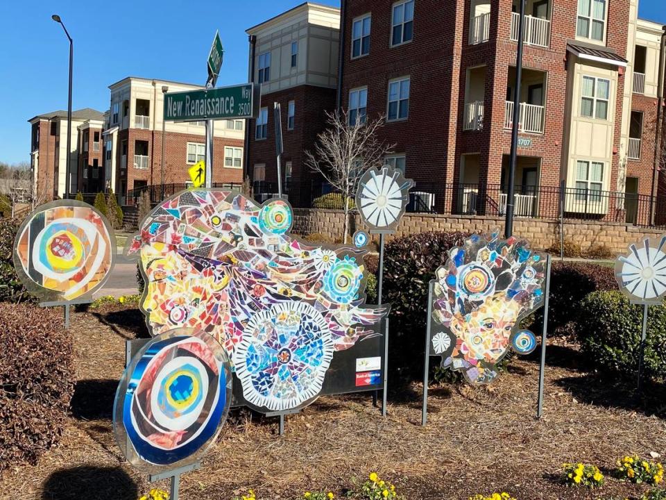 A collage titled “Welcoming Dreams” greets people at the entrance to the Renaissance West community.