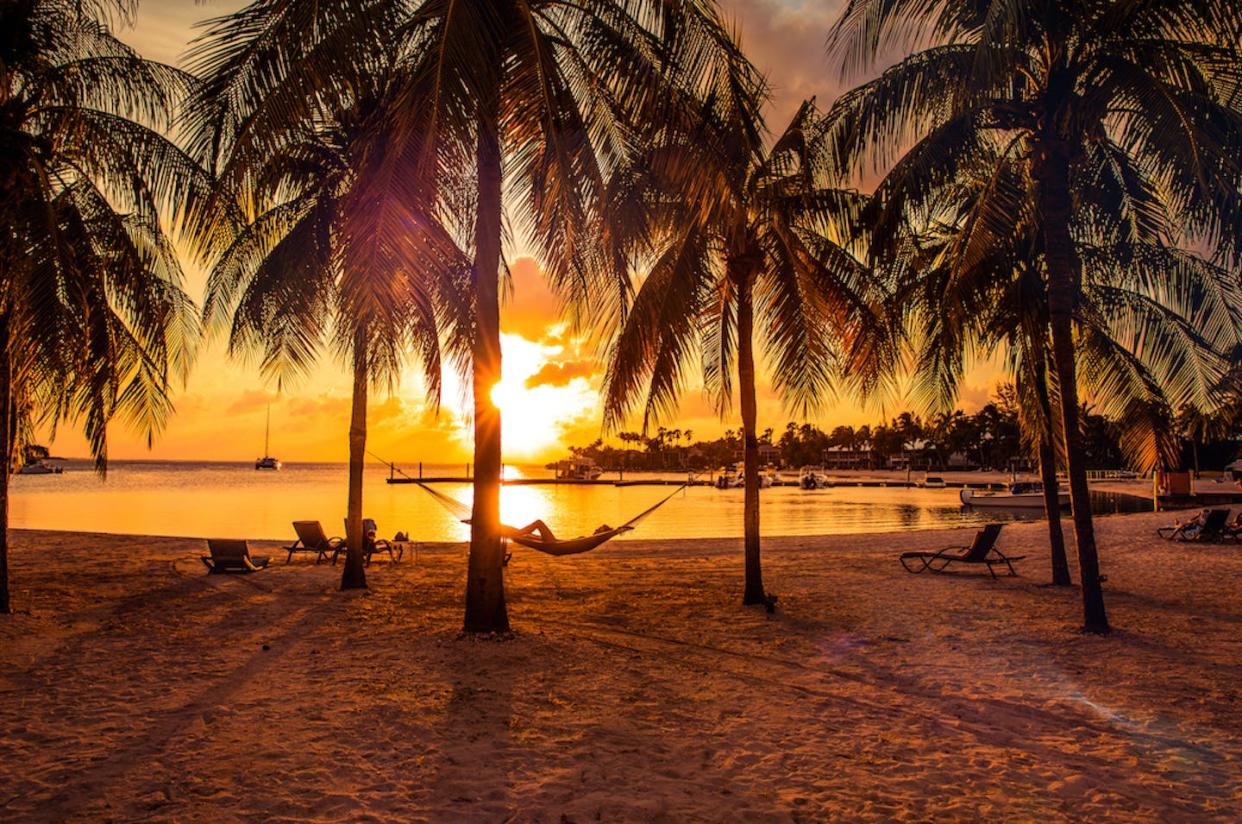 Looks like paradise – especially if you're a multinational corporation in need of a tax haven. <a href="https://www.gettyimages.com/detail/photo/relaxing-on-hammock-after-a-beach-day-in-the-royalty-free-image/897476216?phrase=cayman%20islands" rel="nofollow noopener" target="_blank" data-ylk="slk:LeoPatrizi/E+ via Getty Images;elm:context_link;itc:0;sec:content-canvas" class="link ">LeoPatrizi/E+ via Getty Images</a>