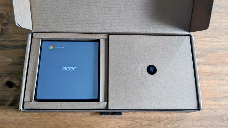 An Acer Chromebox CXI4 mini PC sitting on a wooden desk