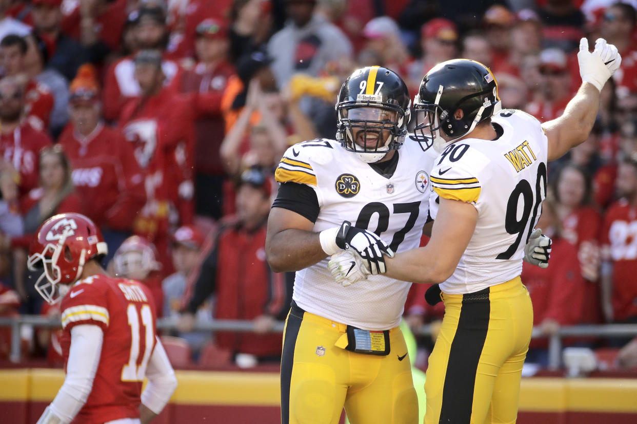 Steelers defensive end Cameron Heyward (97) and outside linebacker T.J. Watt (90) celebrate during their win over the Chiefs. (AP)