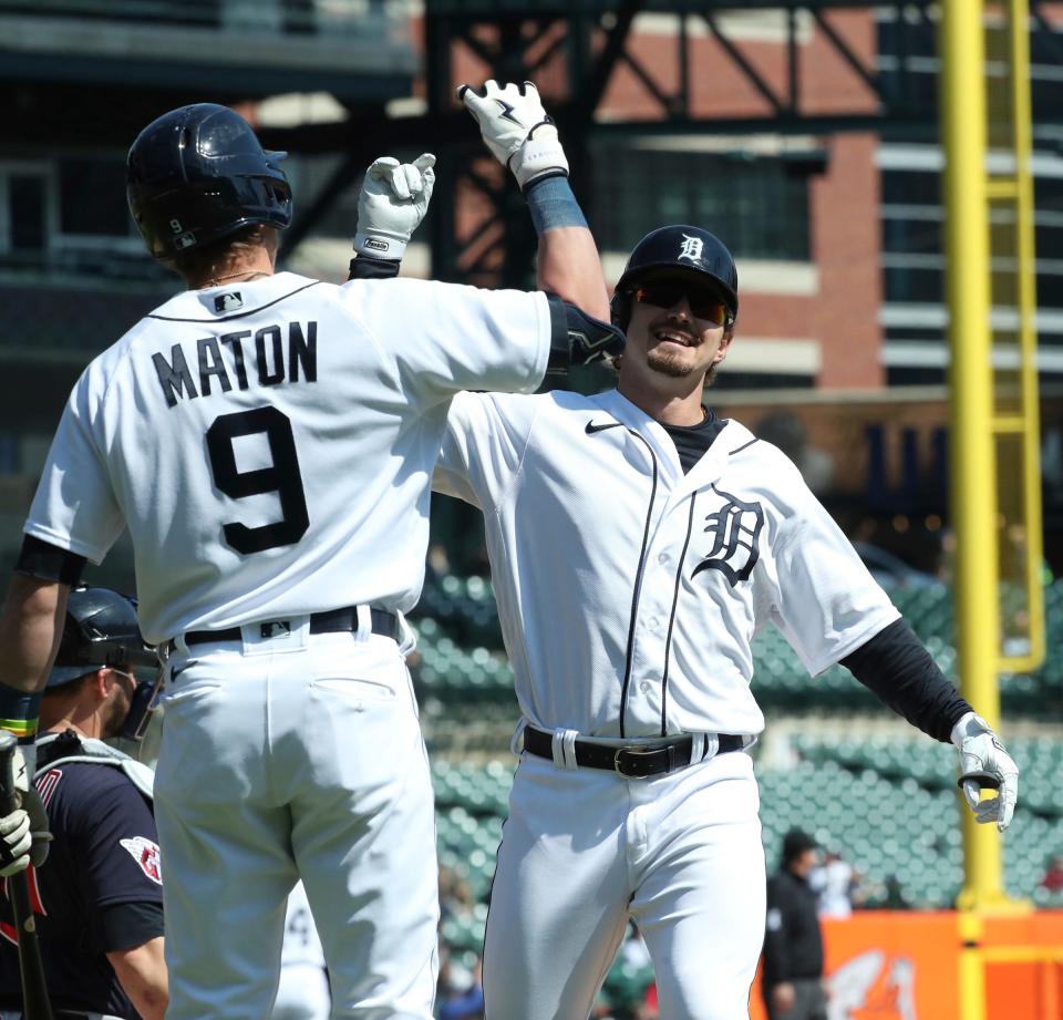 Tigers third baseman Zach McKinstry, right, is met by second baseman Nick Maton after homering against Guardians pitcher James Karinchak during the eighth inning on Wednesday, April 19, 2023, at Comerica Park.
