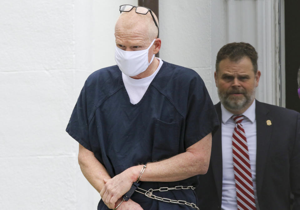 Image: Alex Murdaugh is escorted out of the Collation County Courthouse in Walterboro, S.C., on July 20, 2022. (Tracy Glantz / The State via AP file)