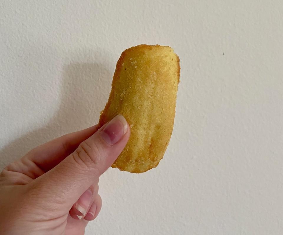 Writer holding a lemon madeleine