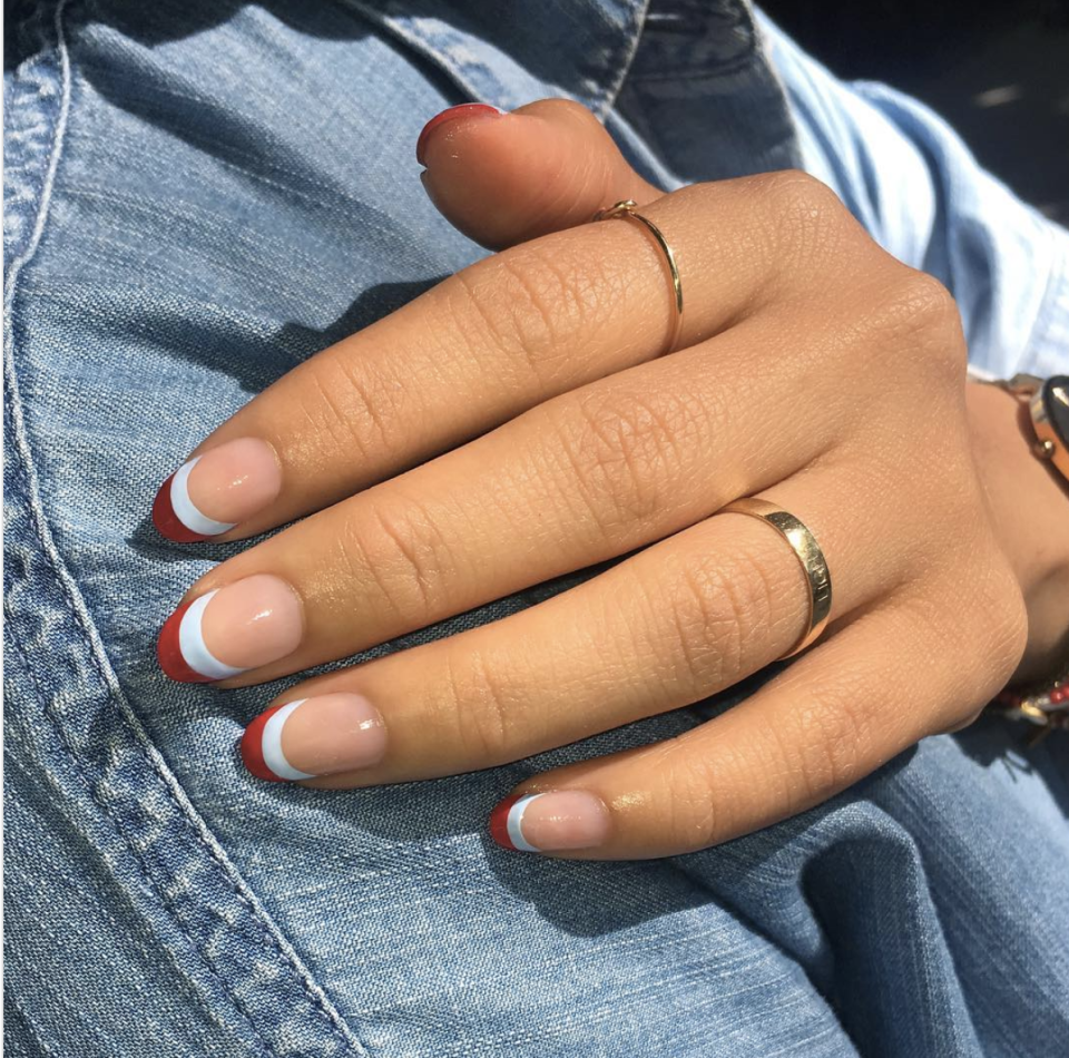 <p>Go for a twist on a classic style with a French manicure in two patriotic colors. Light blue makes this look even more wearable.</p><p><a class="link " href="https://www.amazon.com/Orly-Half-Moon-Guides-Count/dp/B00FMVR802/?tag=syn-yahoo-20&ascsubtag=%5Bartid%7C10055.g.1278%5Bsrc%7Cyahoo-us" rel="nofollow noopener" target="_blank" data-ylk="slk:SHOP GUIDE TAPE;elm:context_link;itc:0;sec:content-canvas">SHOP GUIDE TAPE</a></p>