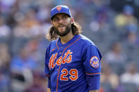 New York Mets starting pitcher Trevor Williams (29) walks back to the dugout after he is relieved in the fourth inning of a baseball game against the Texas Rangers, Saturday, July 2, 2022, in New York. (AP Photo/John Minchillo)