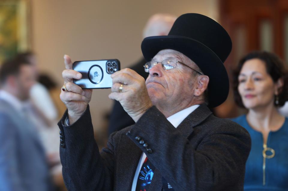 Guest service missionary Dil Strasser takes a photo for someone before the Sunday morning session of the 193rd Semiannual General Conference of The Church of Jesus Christ of Latter-day Saints at the Conference Center in Salt Lake City on Sunday, Oct. 1, 2023. | Jeffrey D. Allred, Deseret News