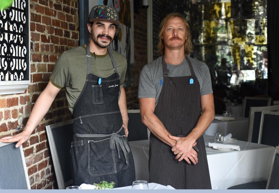 Sous Chef Hunter Jones, left, and Executive Chef Carson Jewell in the dining room at manna in Wilmington, N.C., Wednesday, July 21, 2021. Jewell took over at the restaurant last year.