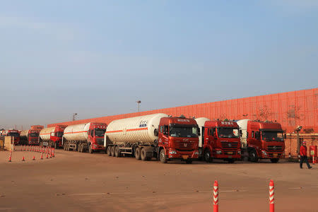 Gas trailers line up for filling liquefied natural gas at Caofeidian terminal, in Tangshan, Hebei province, China October 17, 2017. Picture taken October 17, 2017. REUTERS/ Aizhu Chen