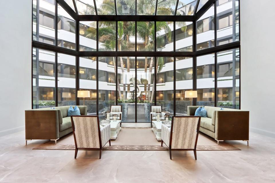 Windows in a common area overlook the central atrium at Palm Beach Hampton on the South End.