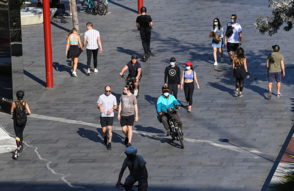 People out walking and cycling in Tumbalong Park on August 22, 2021 in Sydney, Australia. 