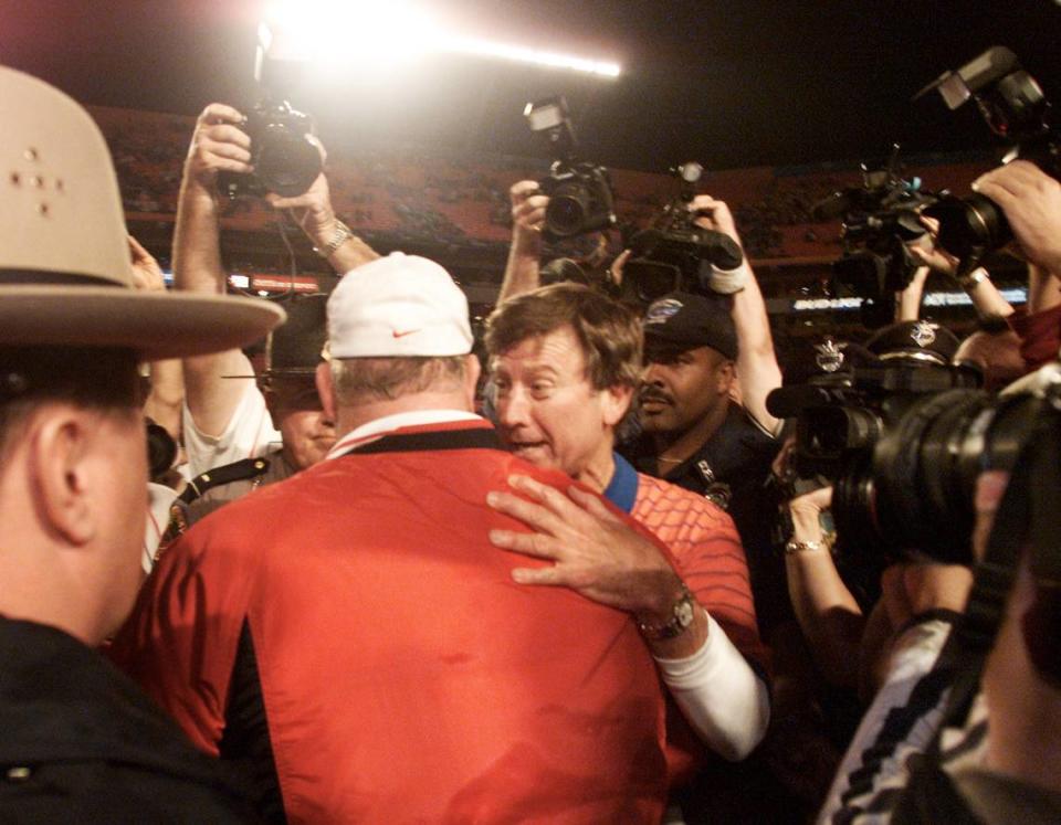 Florida coach Steve Spurrier, right, talks to Maryland coach Ralph Friedgen after the Gators won the Orange Bowl Game in 2002.