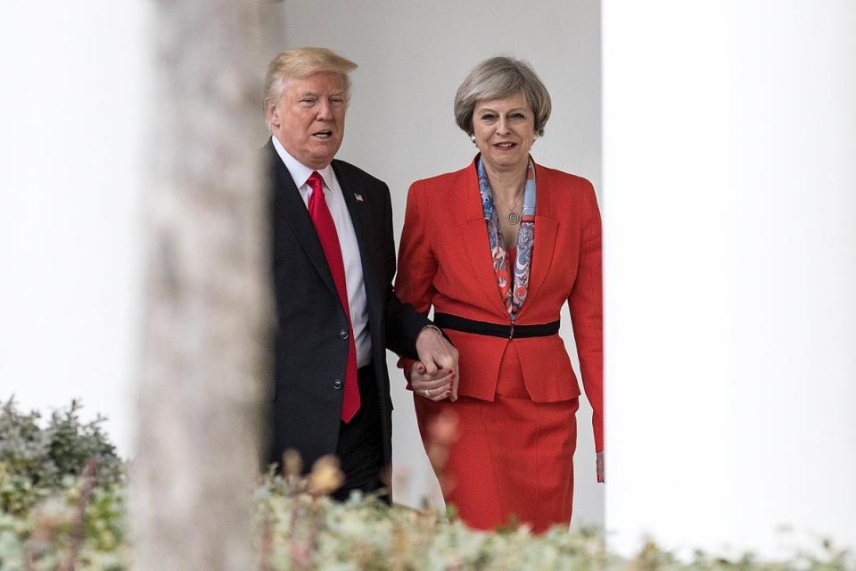 Former Prime Minister Theresa May and former U.S. President Donald Trump walk along The Colonnade of the West Wing at The White House on January 27, 2017 (Getty Images)