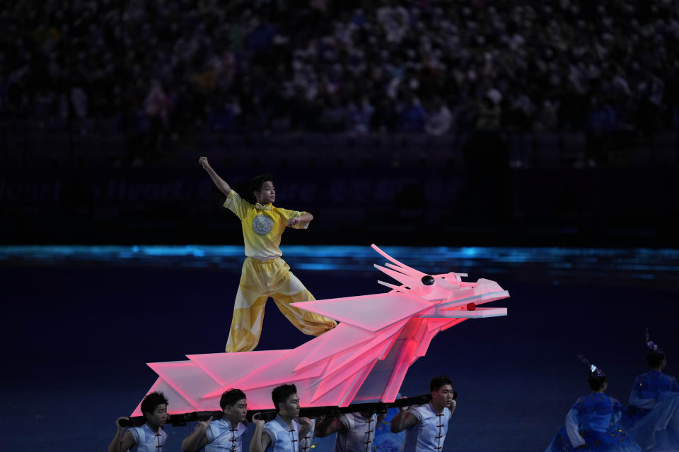 Artists perform ahead of the opening ceremony of the 19th Asian Games in Hangzhou, China, Saturday, Sept. 22, 2023. (AP Photo/Dita Alangkara)