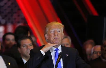 Republican U.S. presidential candidate and businessman Donald Trump gestures as he speaks to supporters at his five state primary night rally held at the Trump Tower in Manhattan, New York, U.S., April 26, 2016. REUTERS/Lucas Jackson