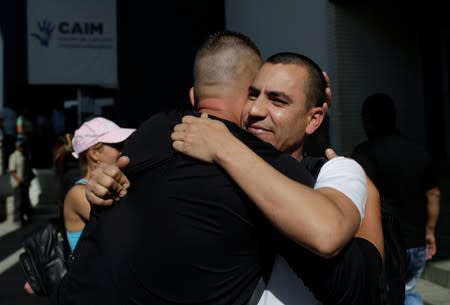 Cubans congratulate fellow citizens minutes before heading to their asylum interview to the United States at the premises of the state migrant assistance office in Ciudad Juarez
