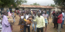 Parents are reunited with released students of the Bethel Baptist High School in Damishi, Nigeria, on Sunday, July 25, 2021. Armed kidnappers in Nigeria have released 28 of the more than 120 students who were abducted at the beginning of July from the Bethel Baptist High School in the northern town of Damishi. Church officials handed those children over to their parents at the school on Sunday. (AP Photo)