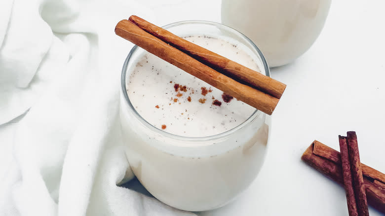 horchata glass with cinnamon stick garnish