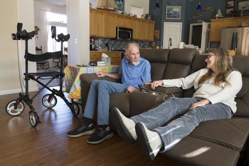 Gary and Tammie Mund watch TV at their Sparks, Nev., home.