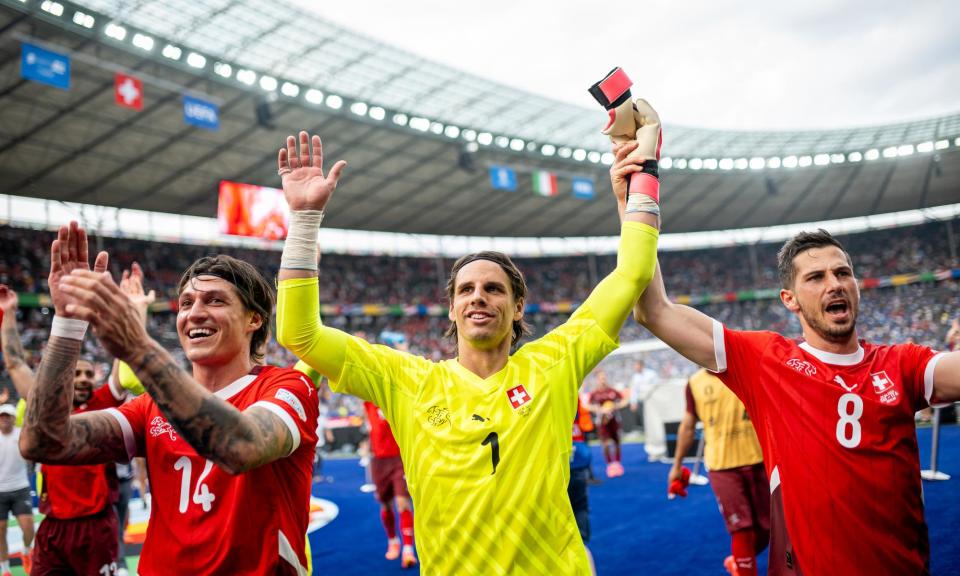 <span>From left to right: Steven Zuber, Yann Sommer and Remo Freuler celebrate after knocking out the defending champions Italy.</span><span>Photograph: Mateusz Słodkowski/Getty Images</span>