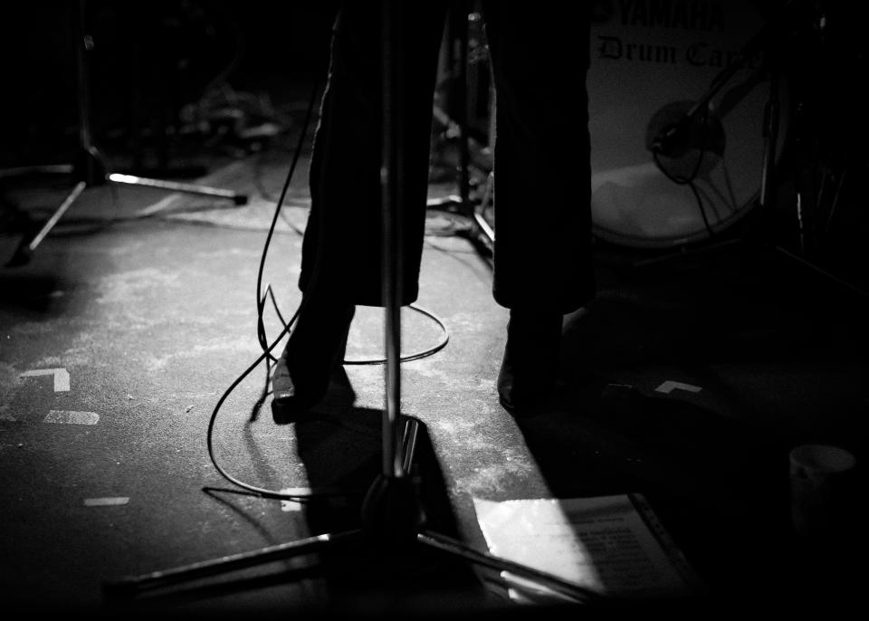 New female singer Eliott's shoes is pictured here on stage with her set list and band