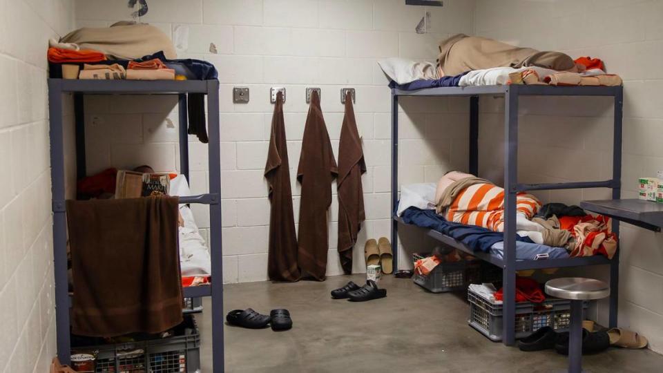 Incarcerated people sleep in a cell in the medium custody section.