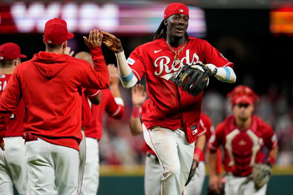 Cincinnati Reds third baseman Elly De La Cruz celebrates with teammates