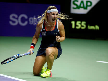 Tennis - Singapore WTA Finals Round Robin Singles - Singapore Indoor Stadium, Singapore - 27/10/2016. Dominika Cibulkova of Slovakia celebrates after defeating Simona Halep of Romania. REUTERS/Edgar Su