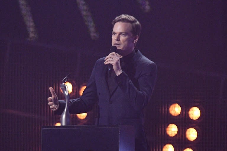 US actor Michael C Hall talks as he collects the award for British male solo artist on behalf of late British pop icon David Bowie during the BRIT Awards 2017 ceremony and live show in London on February 22, 2017