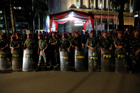 Indonesia's navy soldiers stand guard as Prabowo-Sandi National Campaign Team (BPN) submit documents for challenging the election result outside Indonesia's constitutional court in Jakarta, Indonesia, May 24, 2019. REUTERS/Willy Kurniawan