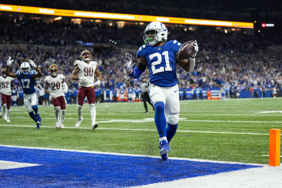 Indianapolis Colts running back Nyheim Hines (21) runs in for a touchdown against the Washington Commanders in the second half of an NFL football game in Indianapolis, Fla., Sunday, Oct. 30, 2022. (AP Photo/AJ Mast)