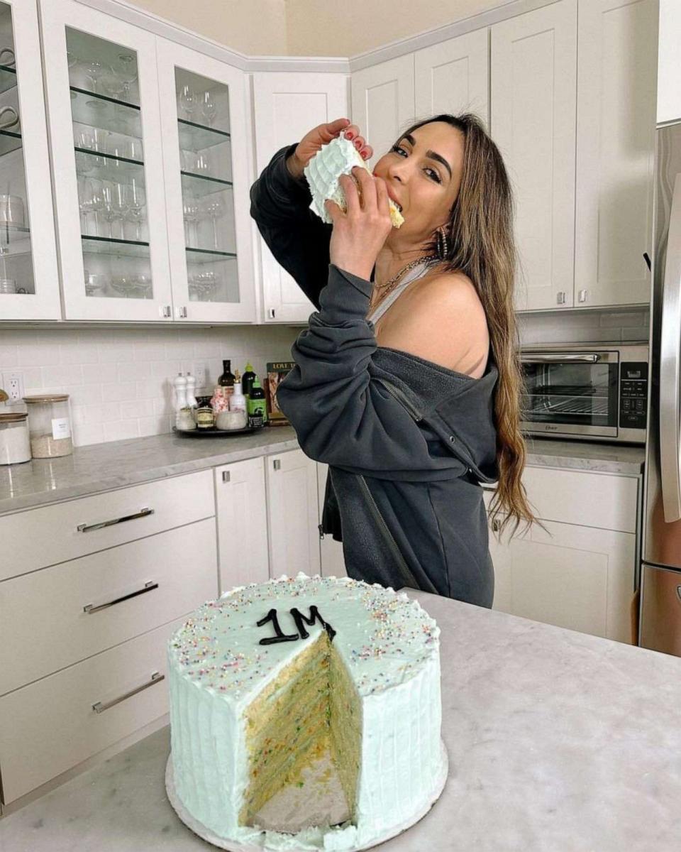 PHOTO: Nicole Keshishian Modic with a slice of cake to celebrate 1 million followers on Instagram. (KaleJunkie)
