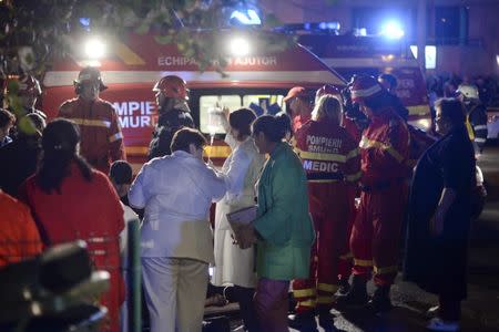 Emergency services work outside a nightclub in Bucharest, Romania October 31, 2015. REUTERS/Inquam Photos