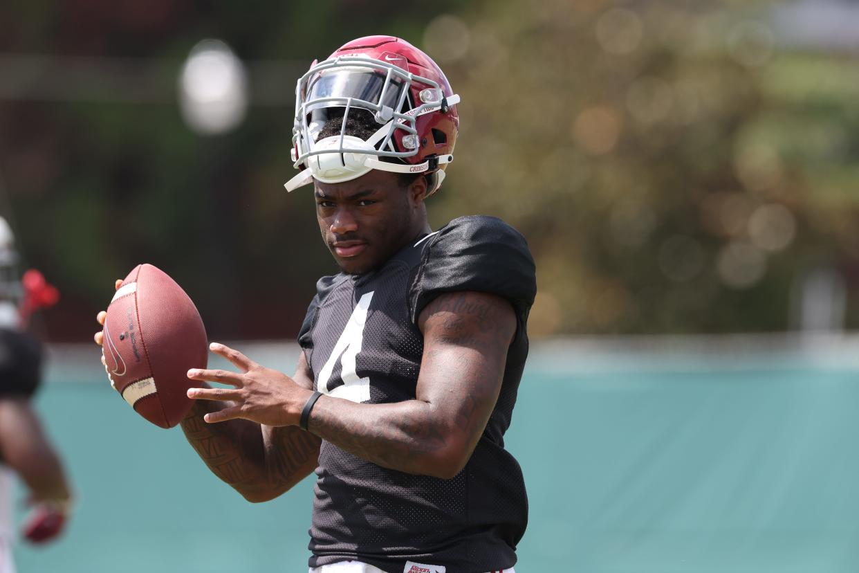 Alabama quarterback Jalen Milroe (4) shows the ball during practice at Thomas-Drew Practice Fields in Tuscaloosa, AL on Tuesday, Aug 15, 2023.