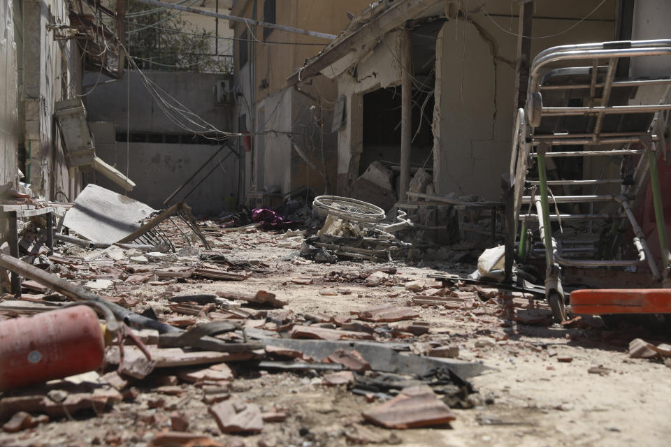 A heavily damaged hospital is seen in the city of Afrin, Syria, Sunday, June 13, 2021. Shells have hit the hospital Saturday, killing at least 13 people, including two medical staff and two ambulance drivers. It was not immediately clear who was behind the shelling, which came from areas where government troops and Kurdish-led fighters are deployed. (AP Photo/Ghaith Alsayed)