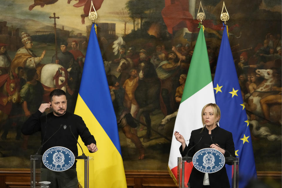 Italian Premier Giorgia Meloni, right, and Ukrainian President Volodymyr Zelenskyy talk with journalists during a press conference after their meeting at Chigi Palace, Government's office, in Rome, Saturday, May 13, 2023. Zelenskyy is in Italy for a one-day visit and will meet with Pope Francis at The Vatican. (AP Photo/Alessandra Tarantino)