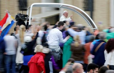 Pope Francis waves as he arrives to lead the general audience in Saint Peter's Square at the Vatican October 26, 2016. REUTERS/Max Rossi