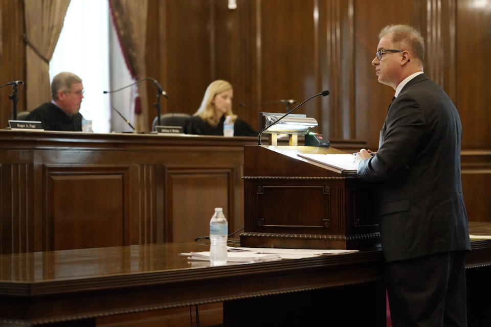 Mark Silvey, right, an attorney for the cleanup workers involved in a 2008 coal ash spill, speaks during a Tennessee Supreme Court hearing Wednesday, June 1, 2022, in Nashville, Tenn. The court heard arguments that can determine whether workers at Tennessee Valley Authority's Kingston Fossil Plant have legal recourse to sue for damages they say were caused by their exposure to coal ash after a 2008 spill at the plant. (AP Photo/Mark Humphrey)