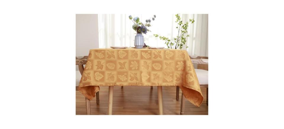 yellow checkered linen tablecloth with patterns of fall leaves