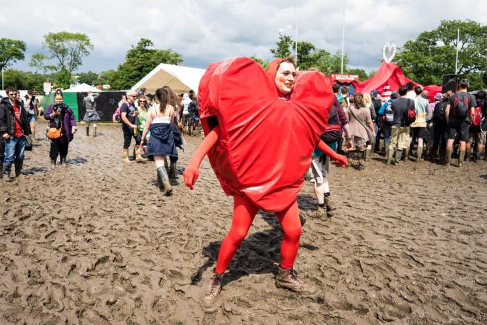 An actor wears a heart-shaped costume in the circus area in 2016 (EPA)