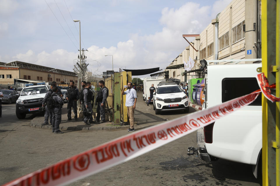 Israeli security forces stand at the entrance of Barkan industrial zone in the West Bank Sunday, Oct. 7, 2018. A Palestinian attacker opened fire at joint Israeli-Palestinian industrial zone in the West Bank Sunday, killing two Israelis and seriously wounding a third, the military said. (AP Photo/Oded Balilty)