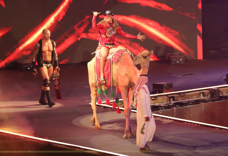 Wrestling - WWE Crown Jewel 2021 - Mohammed Abdu Arena, Riyadh, Saudi Arabia - October 21, 2021 Matt Riddle enters the arena on a camel with Randy Orton REUTERS/Ahmed Yosri