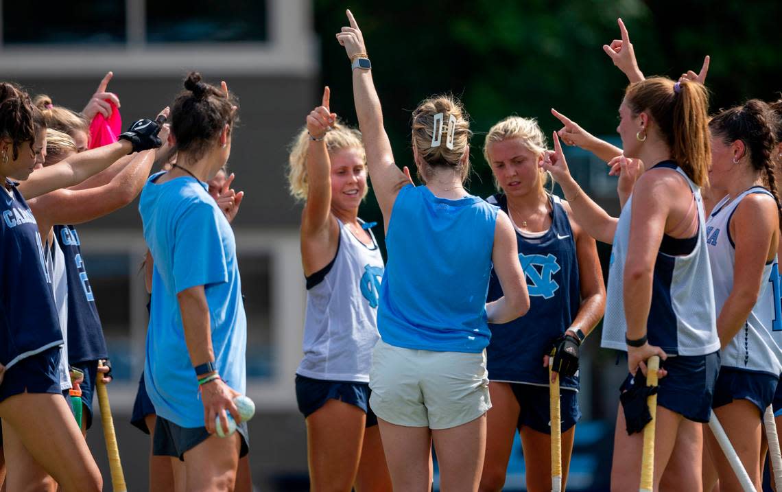 North Carolina field hockey coach Erin Matson huddles with her players during their first practice of the season on Wednesday August 9, 2023 at Karen Shelton Stadium in Chapel Hill, N.C.