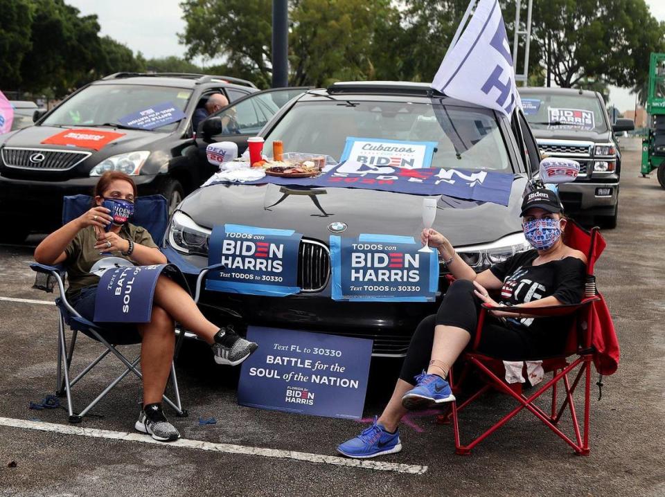 Supporters of VP Joe Biden, Kim Garcia (left) and Barbara Morales, gathered around their cars during a drive-in car rally held by U.S. Senator Kamala Harris, running mate of Democratic presidential nominee Joe Biden held at FIU South Campus in Miami as she campaigns ahead of November 3rd Election Day in South Florida on Saturday, October 31, 2020