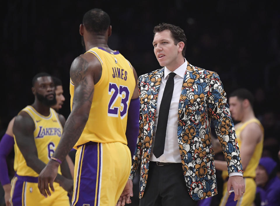 Luke Walton believes players want to play with LeBron James. (AP Photo)