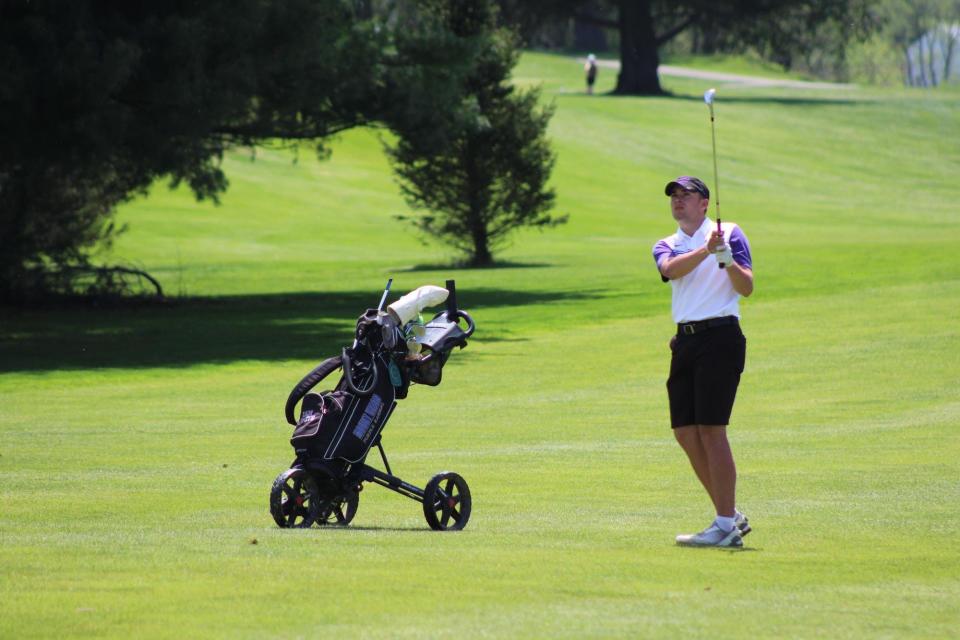 Mount Union junior Ian Smith watches his shot during action at the OAC Golf tournament held at River Greens Golf Course in West Lafayette. Smith, a Cambridge High graduate shared OAC co-medalist honors with John Carroll’s John Order.