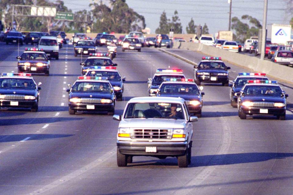 <p>Allen J. Schaben/Los Angeles Times via Getty</p> O.J. Simpson and Al Cowlings in the 