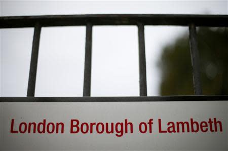 A street sign in Lambeth hangs on railings in south London November 22, 2013. REUTERS/Andrew Winning